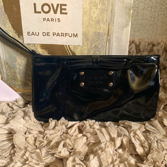 kate spade Handbags - EUC Kate Spade Black Patent Leather Wristlet with Bow Detail & Polka Dot Lining